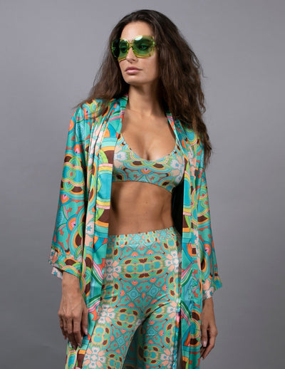 PSYCHEDELIC CROSSES STAR TEAL FLARED PANTS