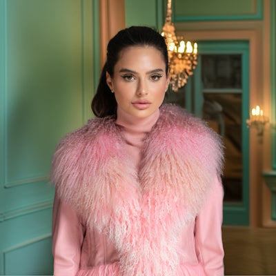 Woman wearing a pink fur coat in an elegant interior setting